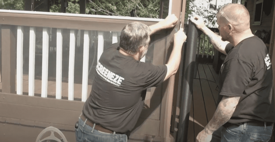 A still image captured from a Screeneze instructional video featuring two professionals showing how to screen in your deck.