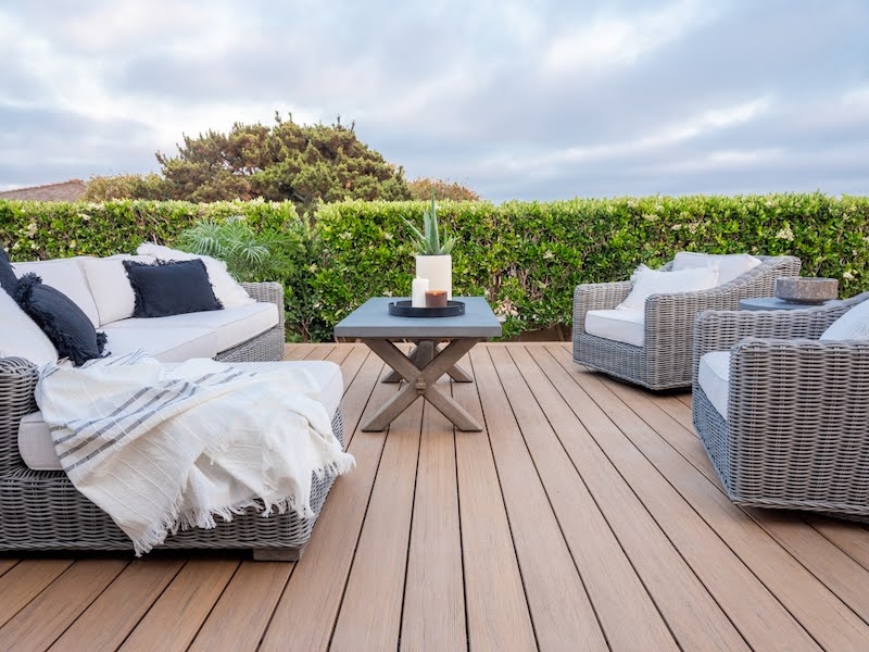 an outdoor patio with a beautiful deck